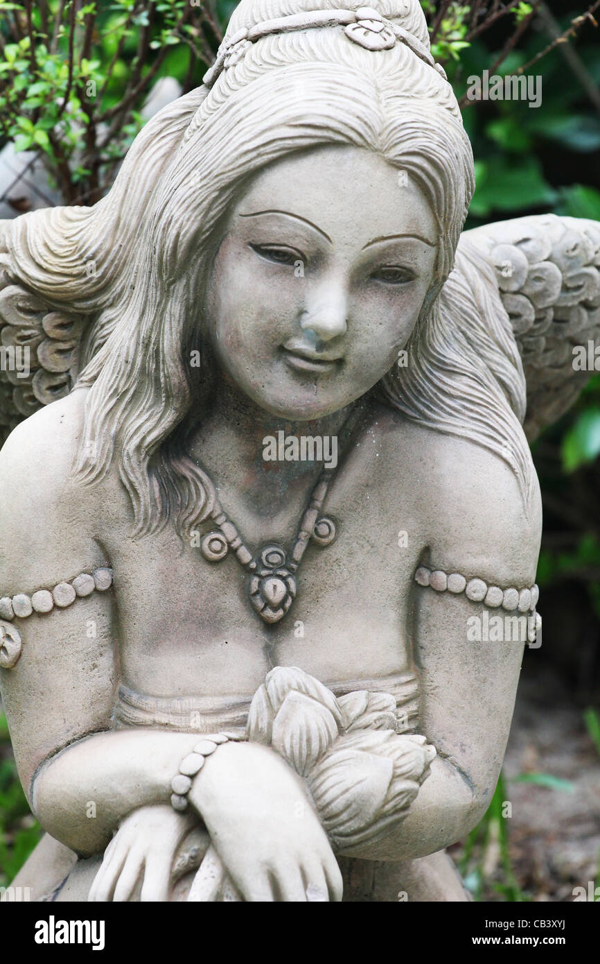 Angel stone statue in a garden in Koh Samui, Thailand. Stock Photo