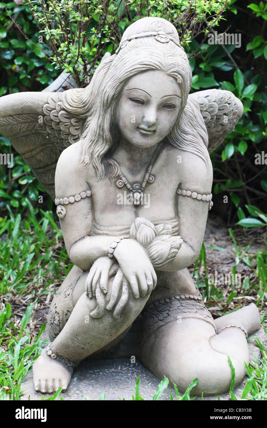 Angel stone statue in a garden in Koh Samui, Thailand. Stock Photo