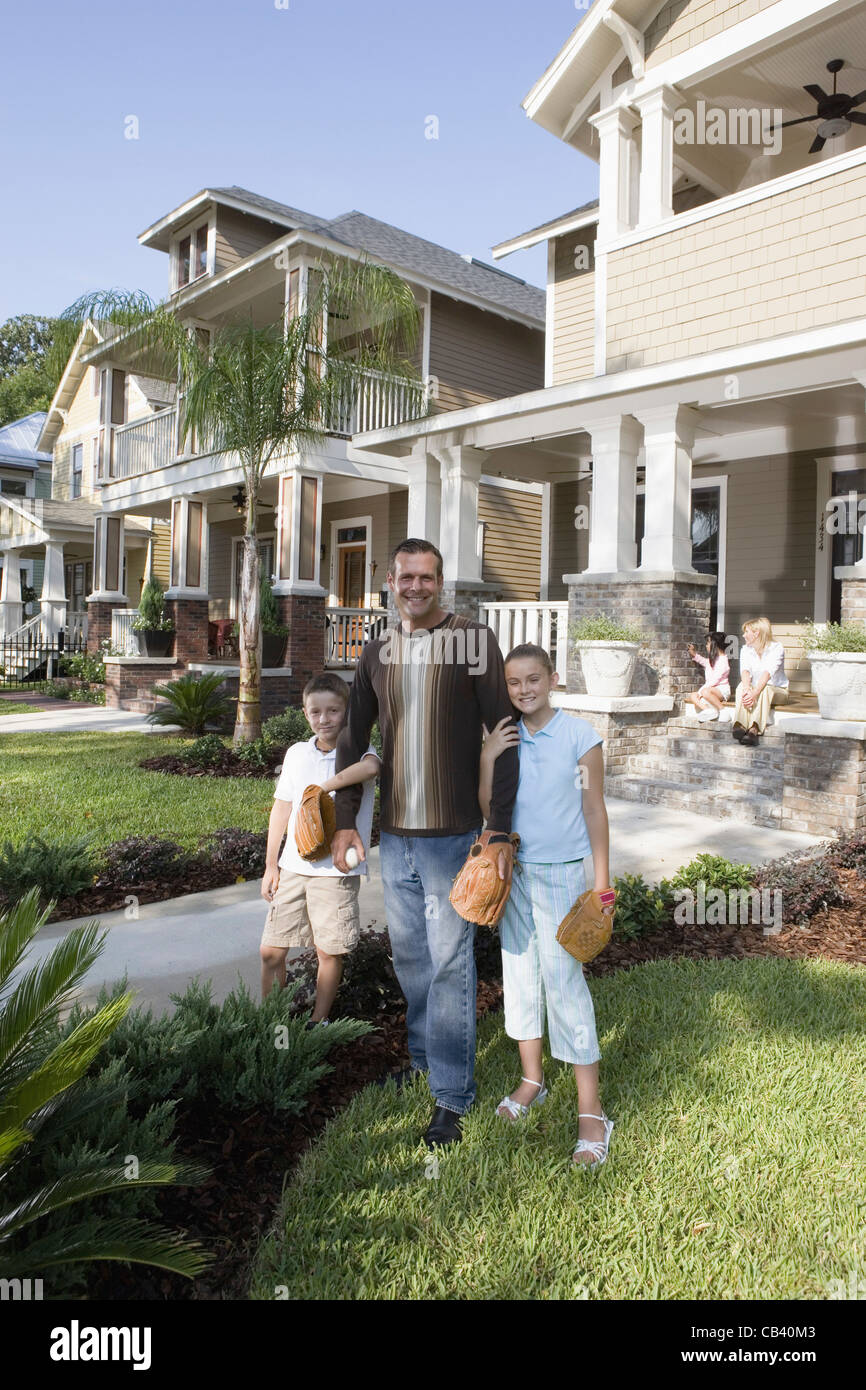 Portrait of a family in front of their house Stock Photo - Alamy