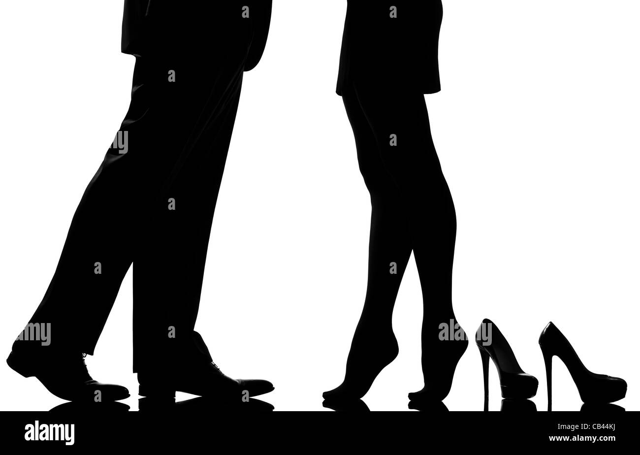 one caucasian detail legs feet couple man and woman tiptoe lovers teenderness in studio silhouette isolated on white background Stock Photo