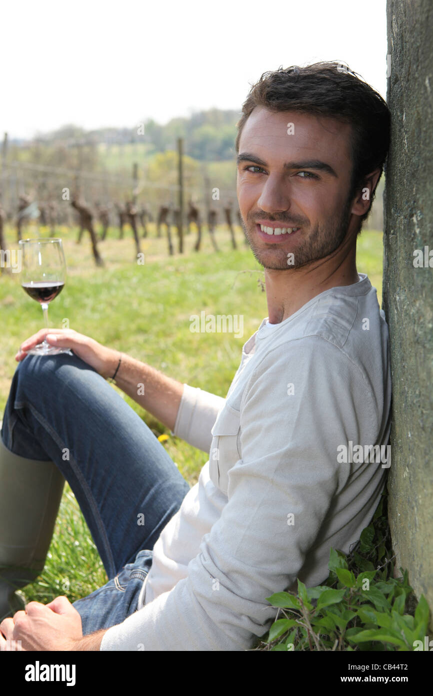 Man drinking wine in field Stock Photo - Alamy