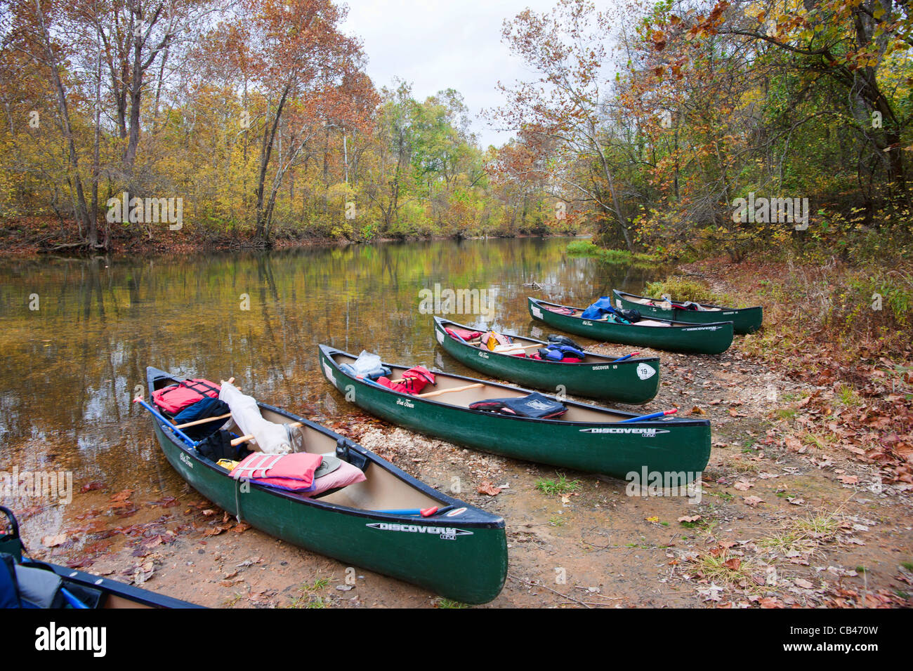 canoes on river edge in missouri Stock Photo