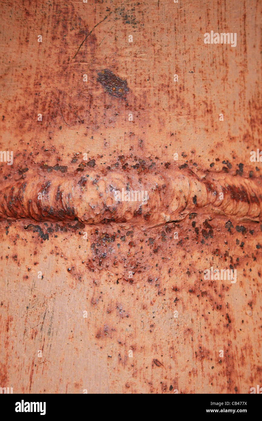 rusted welded steel pipe macro detail Stock Photo