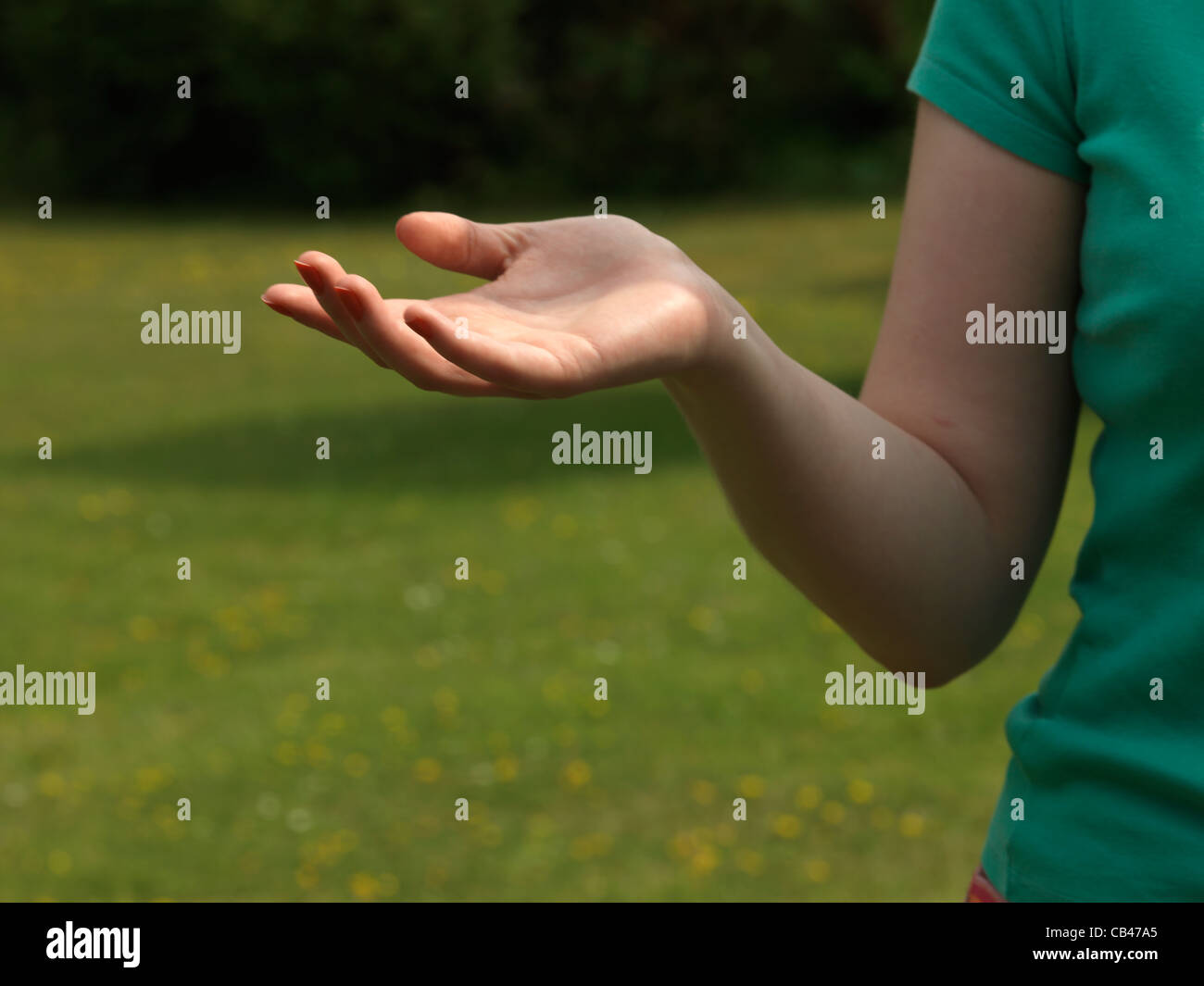 Close Up Of A Woman's Arm And Hand Making A Gesture Stock Photo