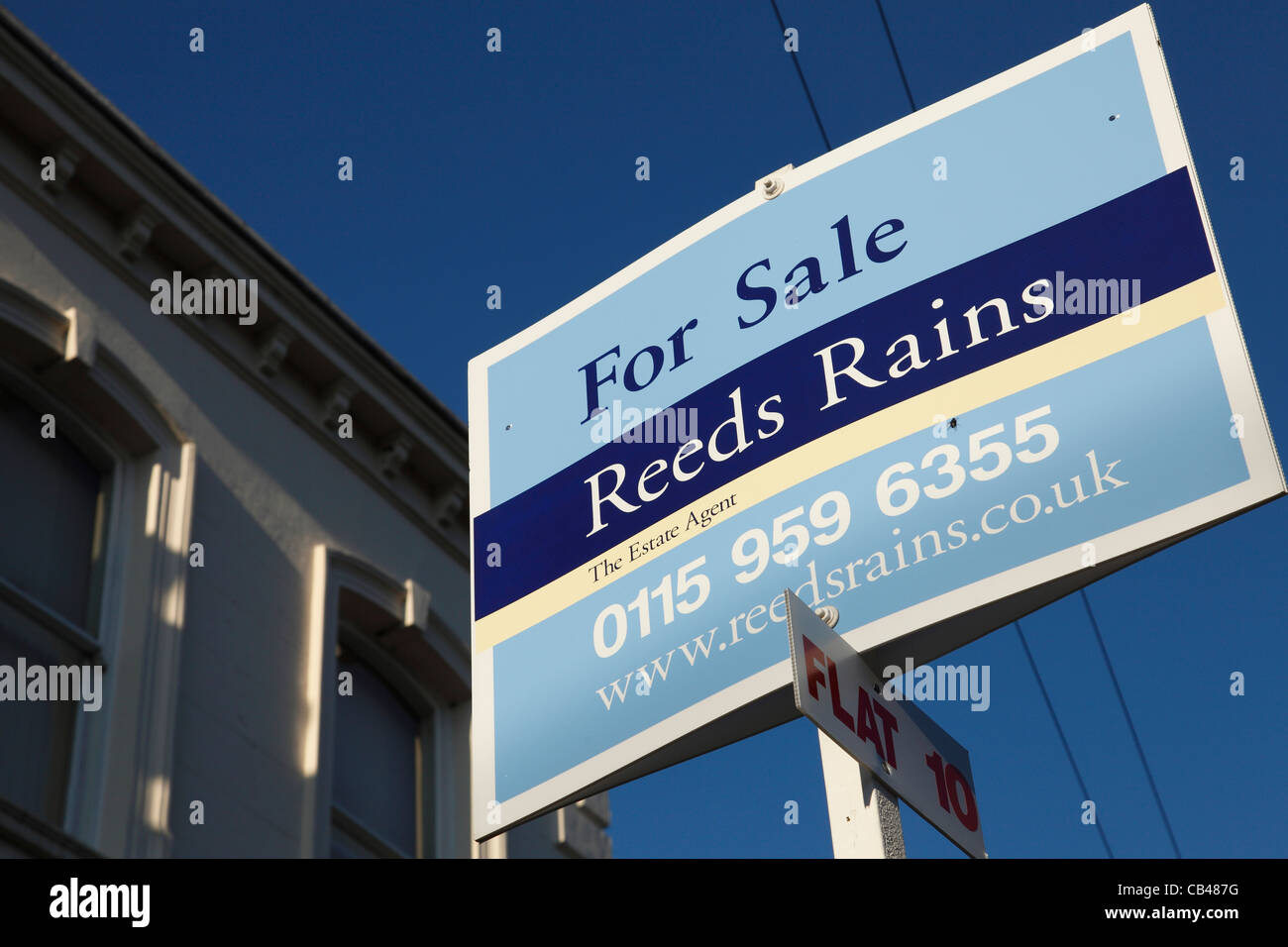 A Reeds Rains estate agents sign outside property for sale in the U.K. Stock Photo
