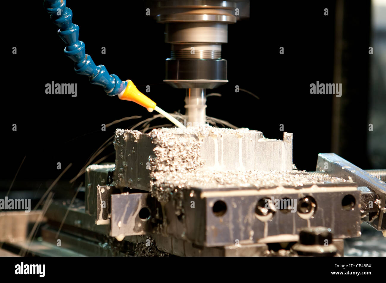 CNC Milling with coolant Stock Photo