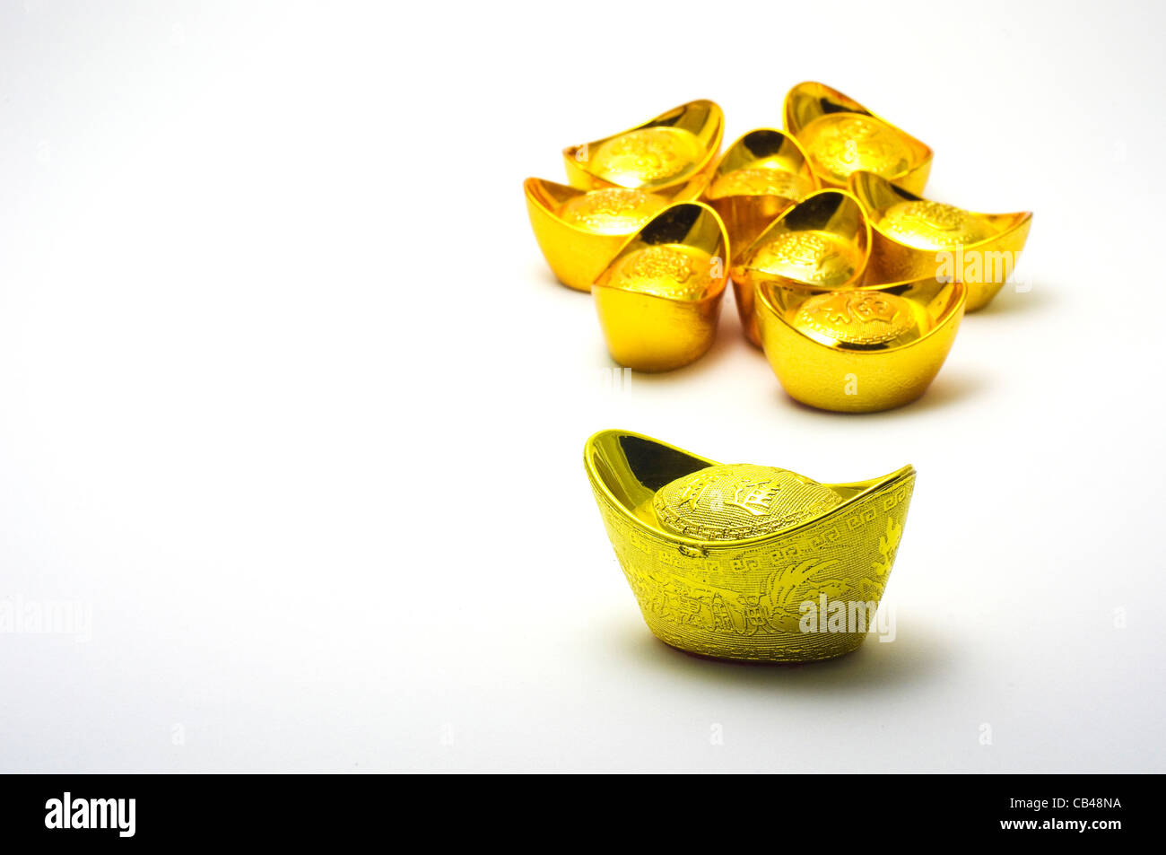 chinese gold ingots, a symbol of wealth for chinese. Stock Photo