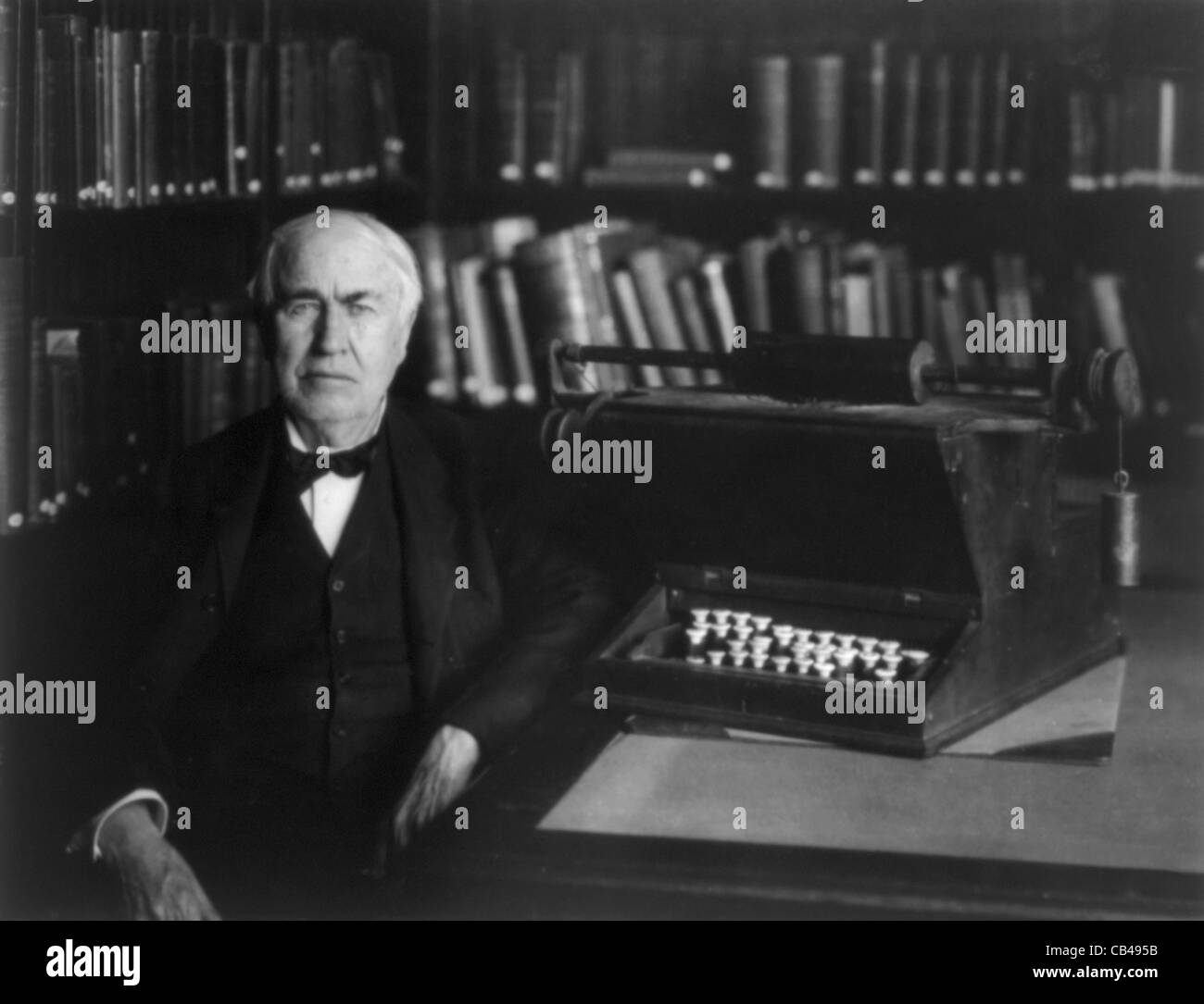 Vintage photo of American inventor and businessman Thomas Alva Edison (1847 – 1931). Edison is pictured circa 1921 with a typewriting machine. Stock Photo