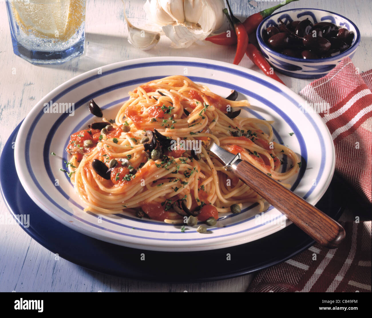 Spaghetti alla puttanesca (olive - caper sauce) Stock Photo