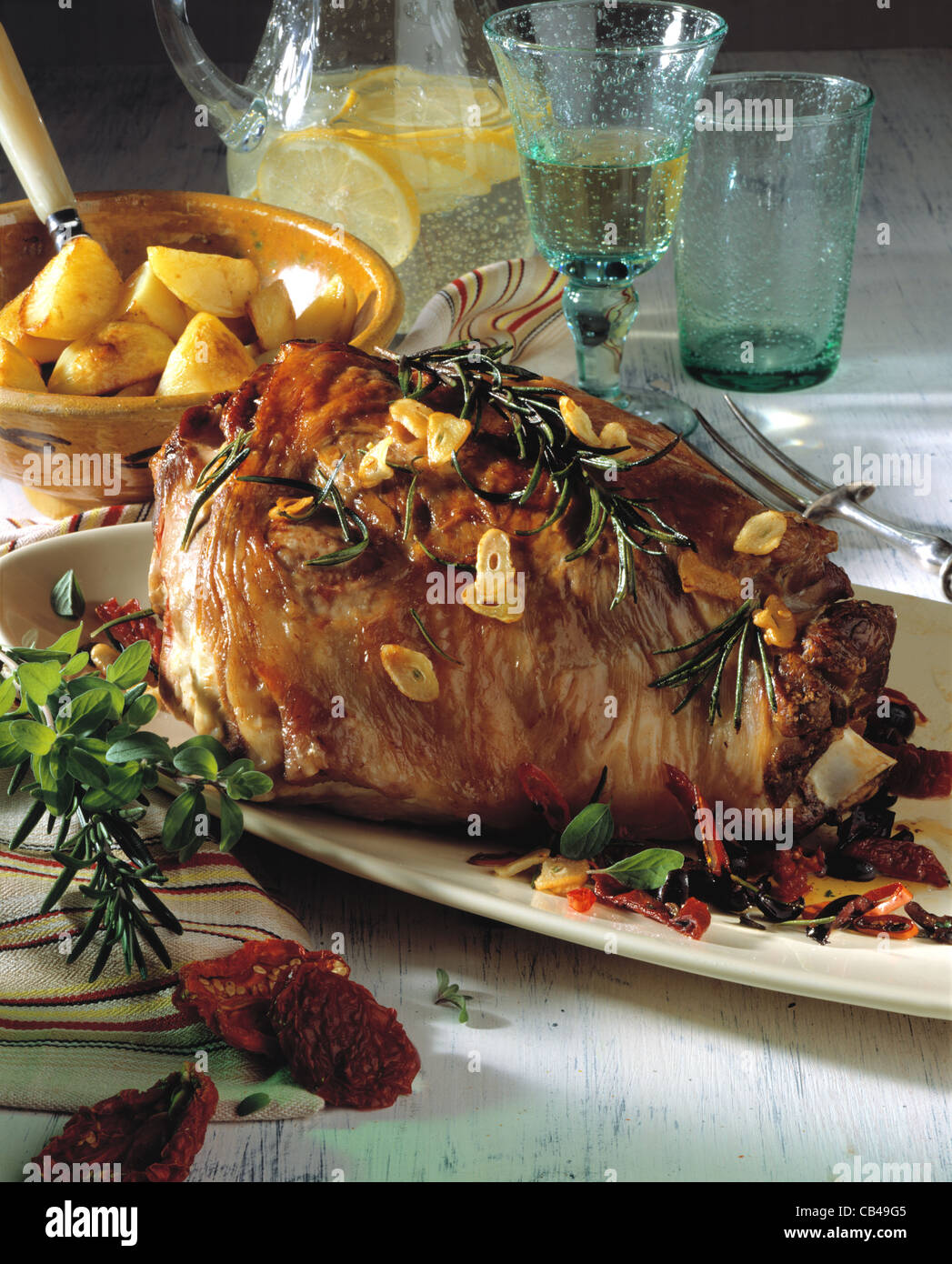 Haunch of lamb with dried tomatos Stock Photo Alamy