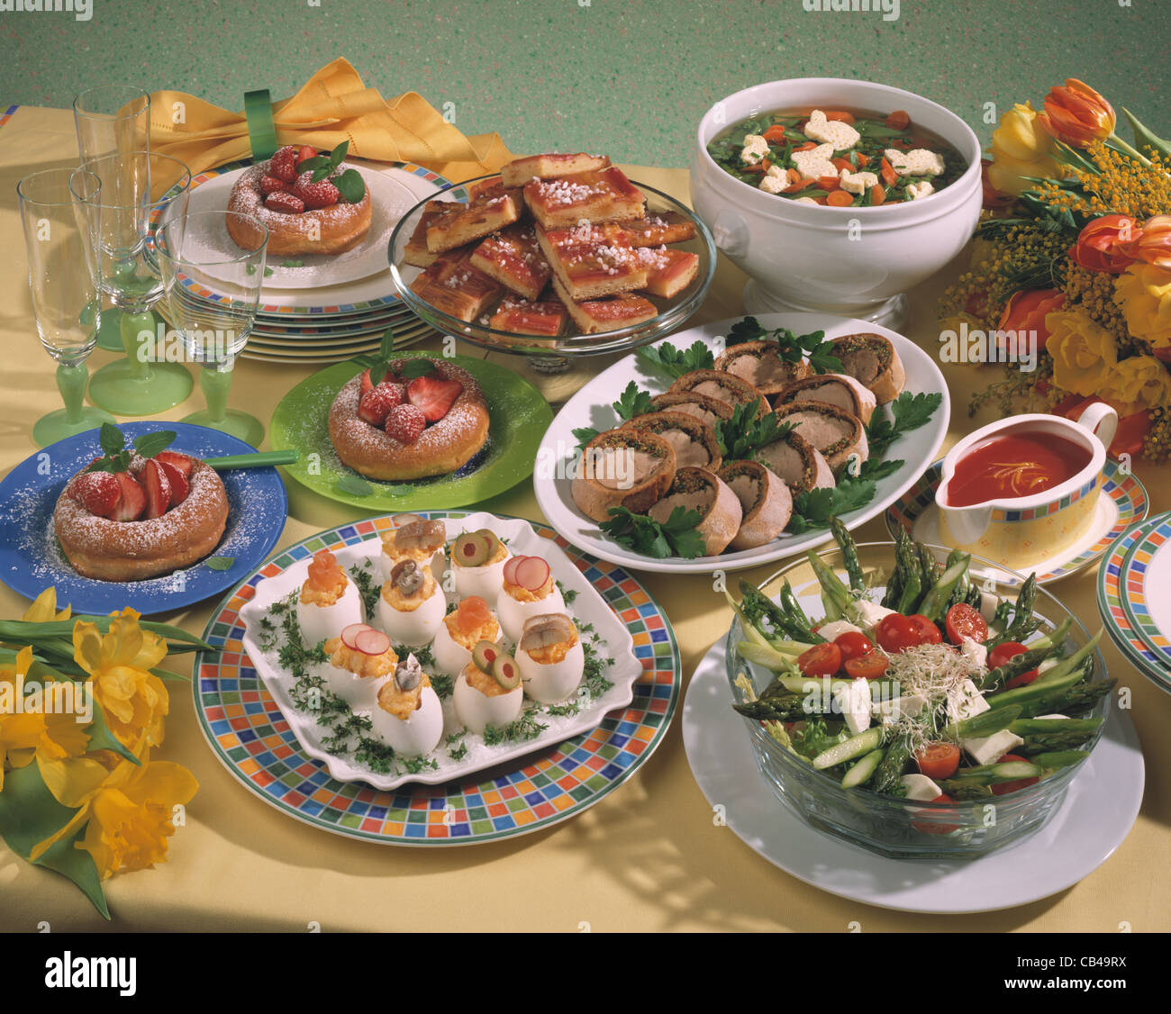 Easter buffet: Vegetable soup, asparagus salad, filled eggs, porkfillet, rhubarb cake Stock Photo