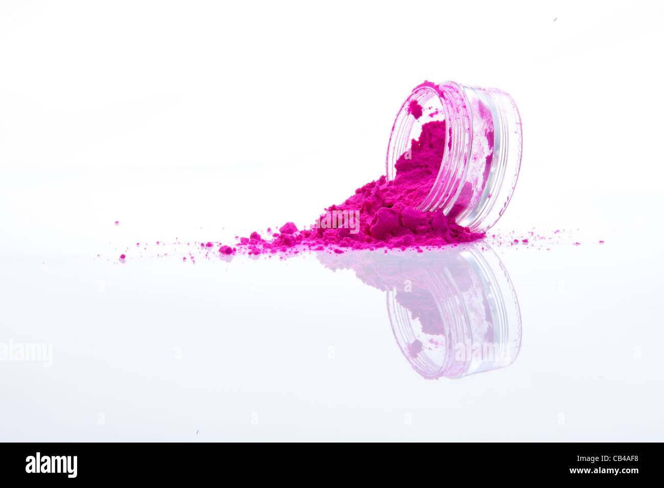 spilled pink makeup powder from jar Stock Photo Alamy