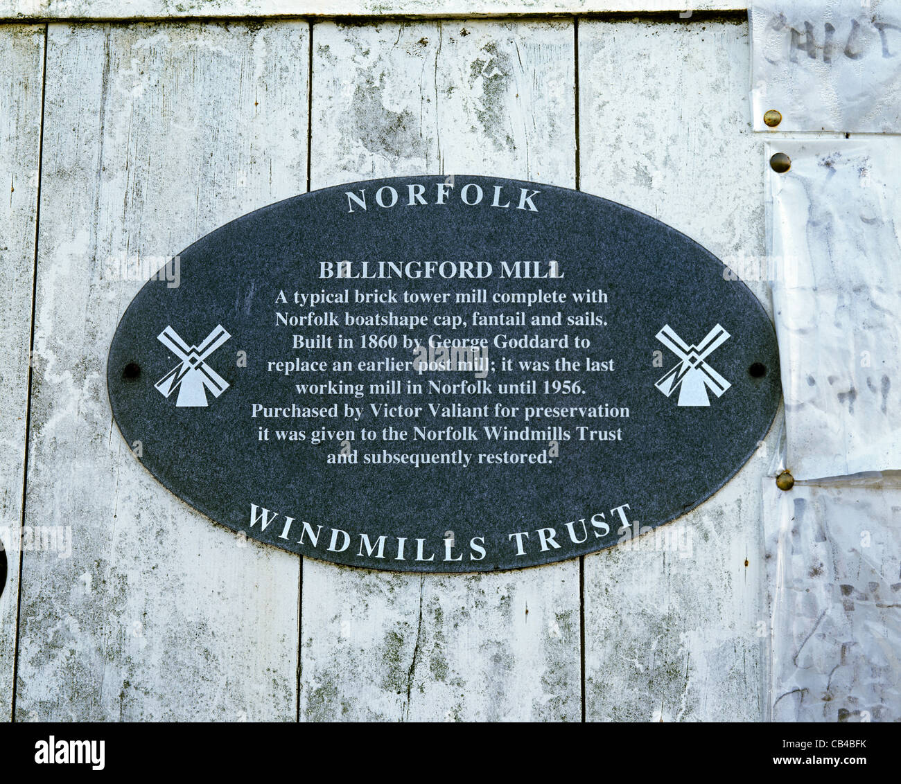 Norfolk Windmills Trust sign on the side of the Billingford tower mill, near Diss, Norfolk. Stock Photo
