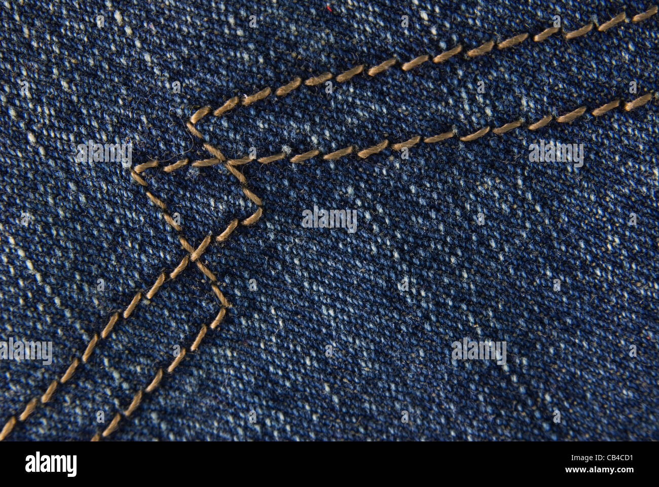 Blue denim jeans texture macro close up. Useful as background for design works. Stock Photo