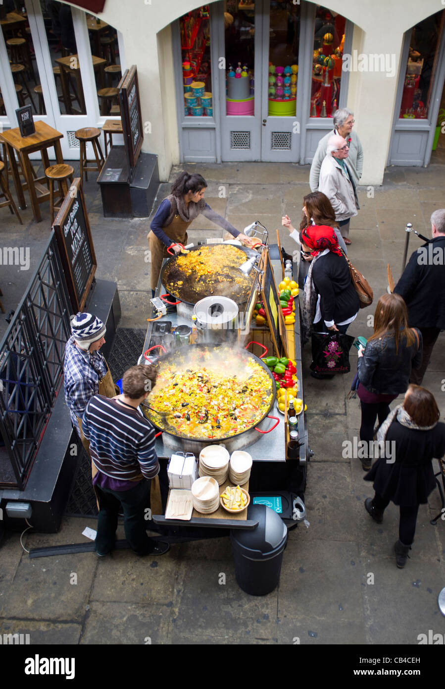Two giant paella dishes selling lunch at Covent garden in central London Stock Photo