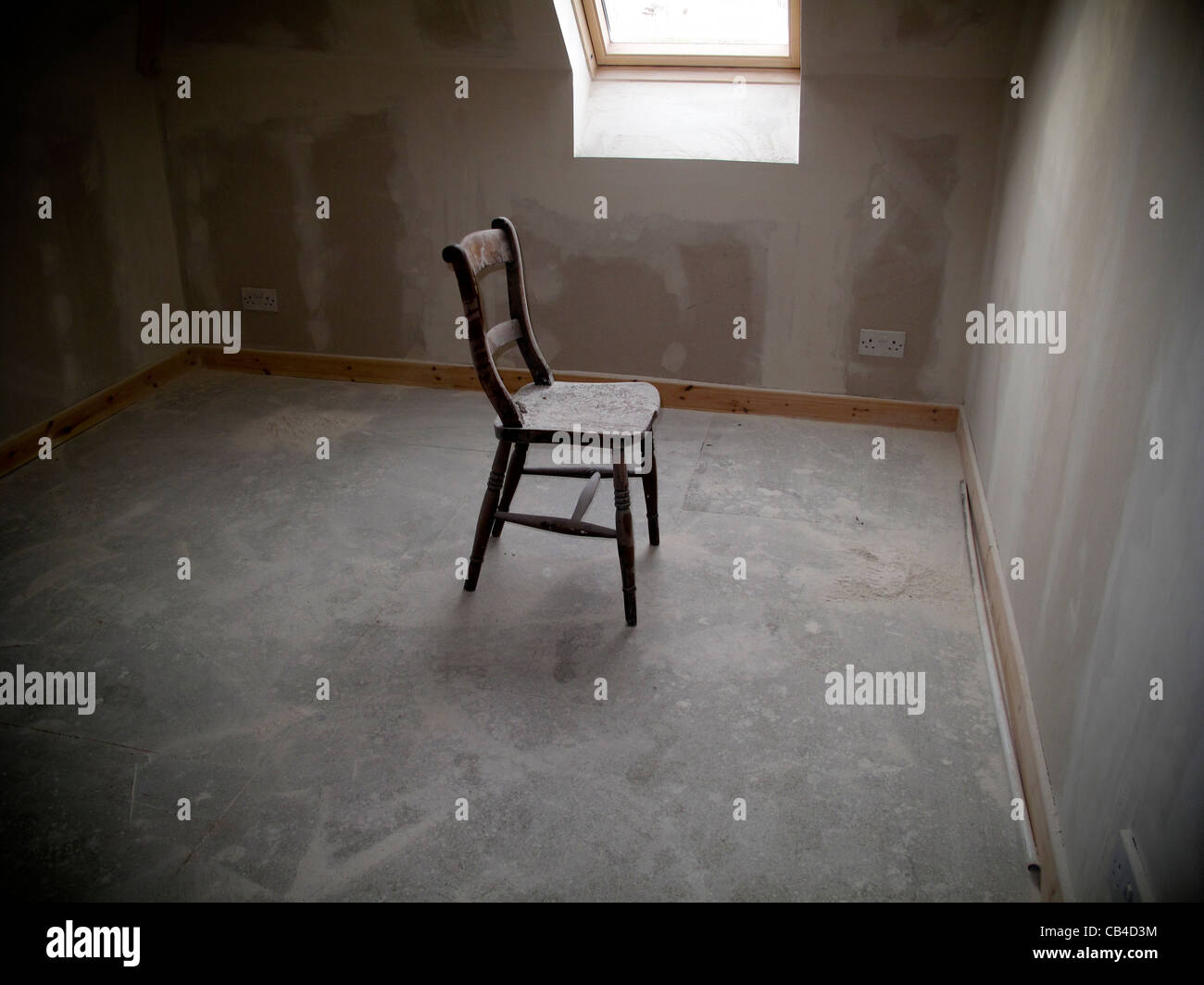 empty wooden chair in empty room Stock Photo
