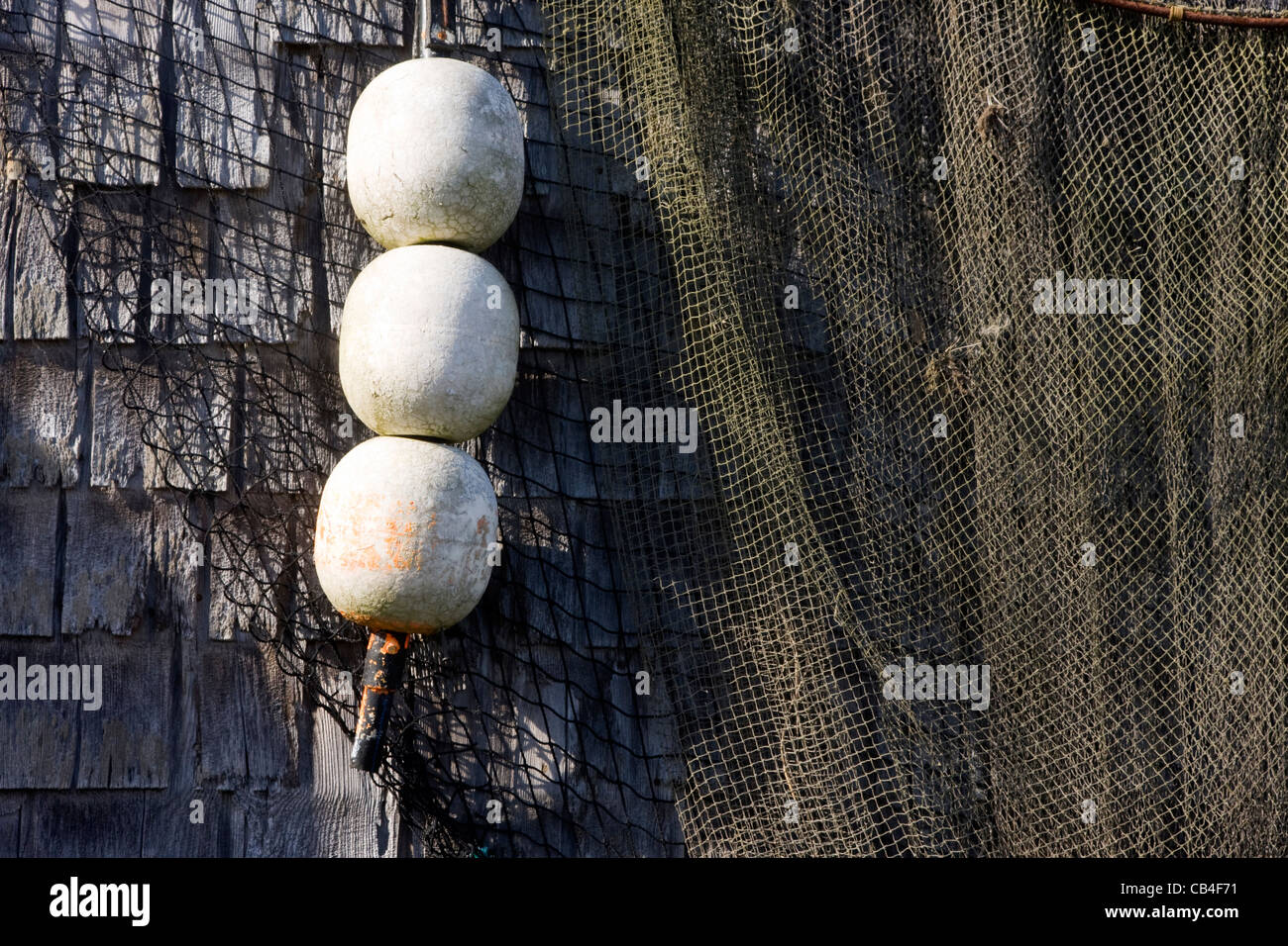 Old buoys on a exterior wall Stock Photo