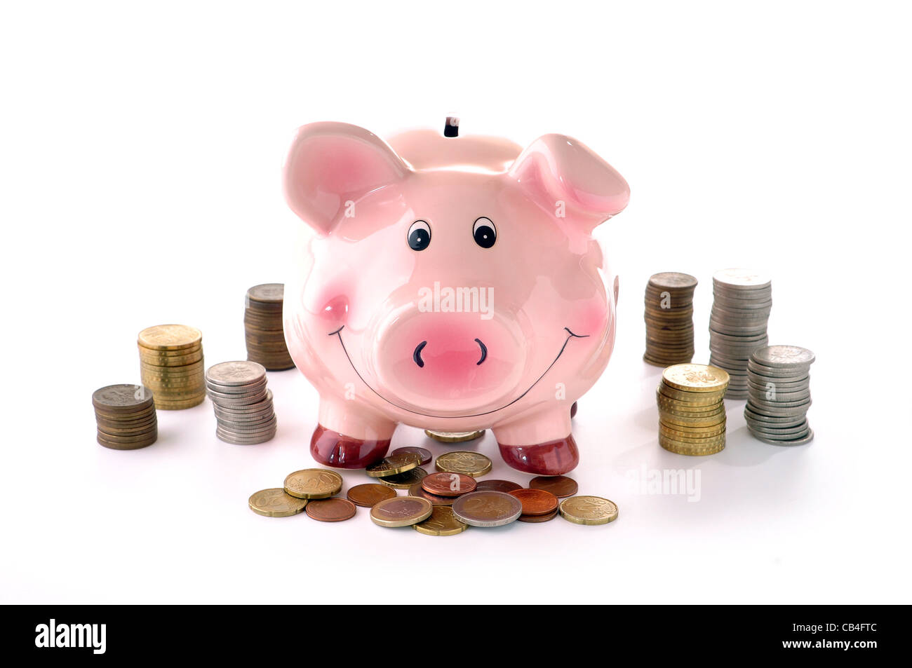 pink piggy banks and coins on a white background Stock Photo - Alamy