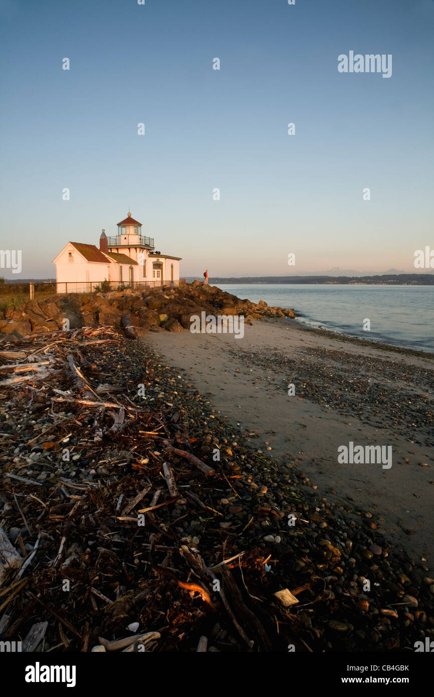 WA02848-00....WASHINGTON - Sunrise at West Point Light along the shores of the Puget Sound in Discovery Park;  Seattle. Stock Photo