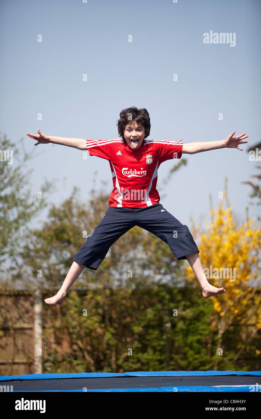 Leaping boy Stock Photo