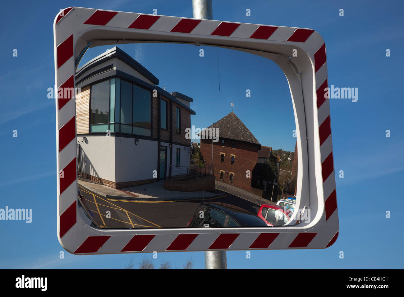 Transport, Road, Safety, Convex mirror used to view oncoming traffic from unsighted exit. Stock Photo