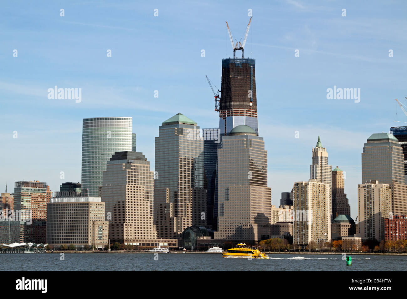 The Freedom Tower under construction and rising from Ground Zero, the scene of the 9/11 terrorist attack. Stock Photo