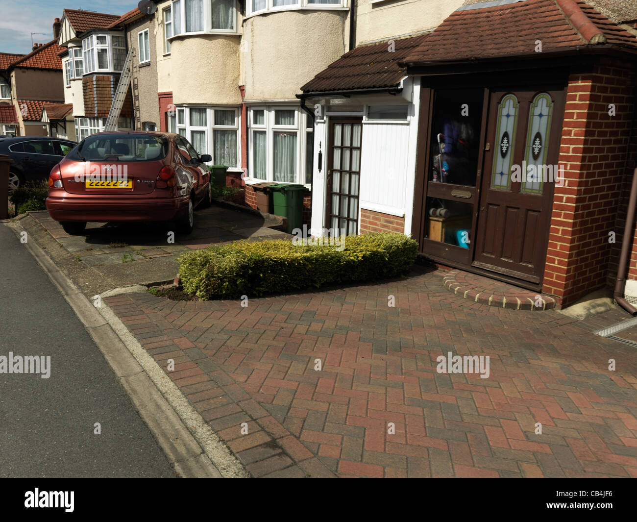 A Row Of Semi-Detached Houses With Gardens Paved Over England Stock Photo