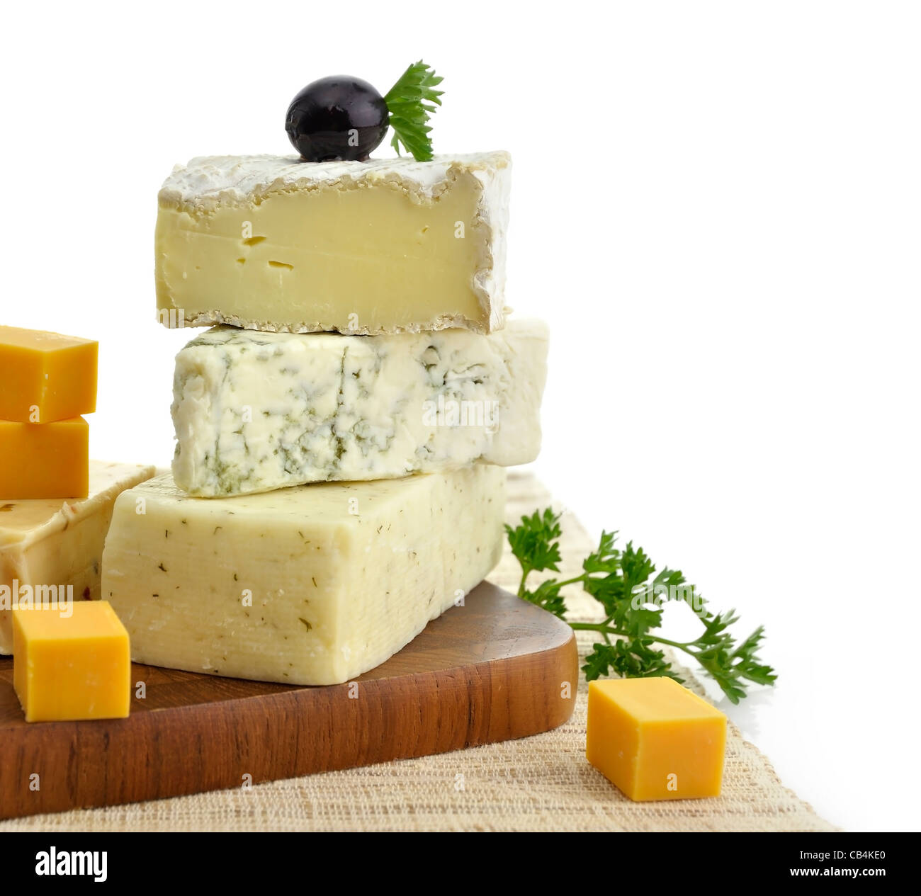 A Stack Of Different Kinds Of Cheese On White Background Stock Photo