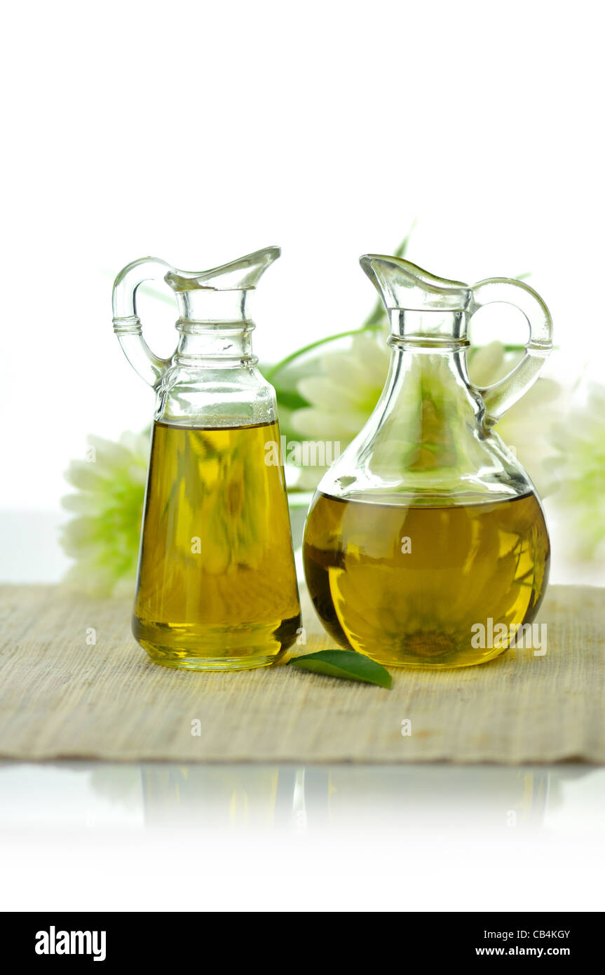 two glass pitchers of natural cooking oil Stock Photo