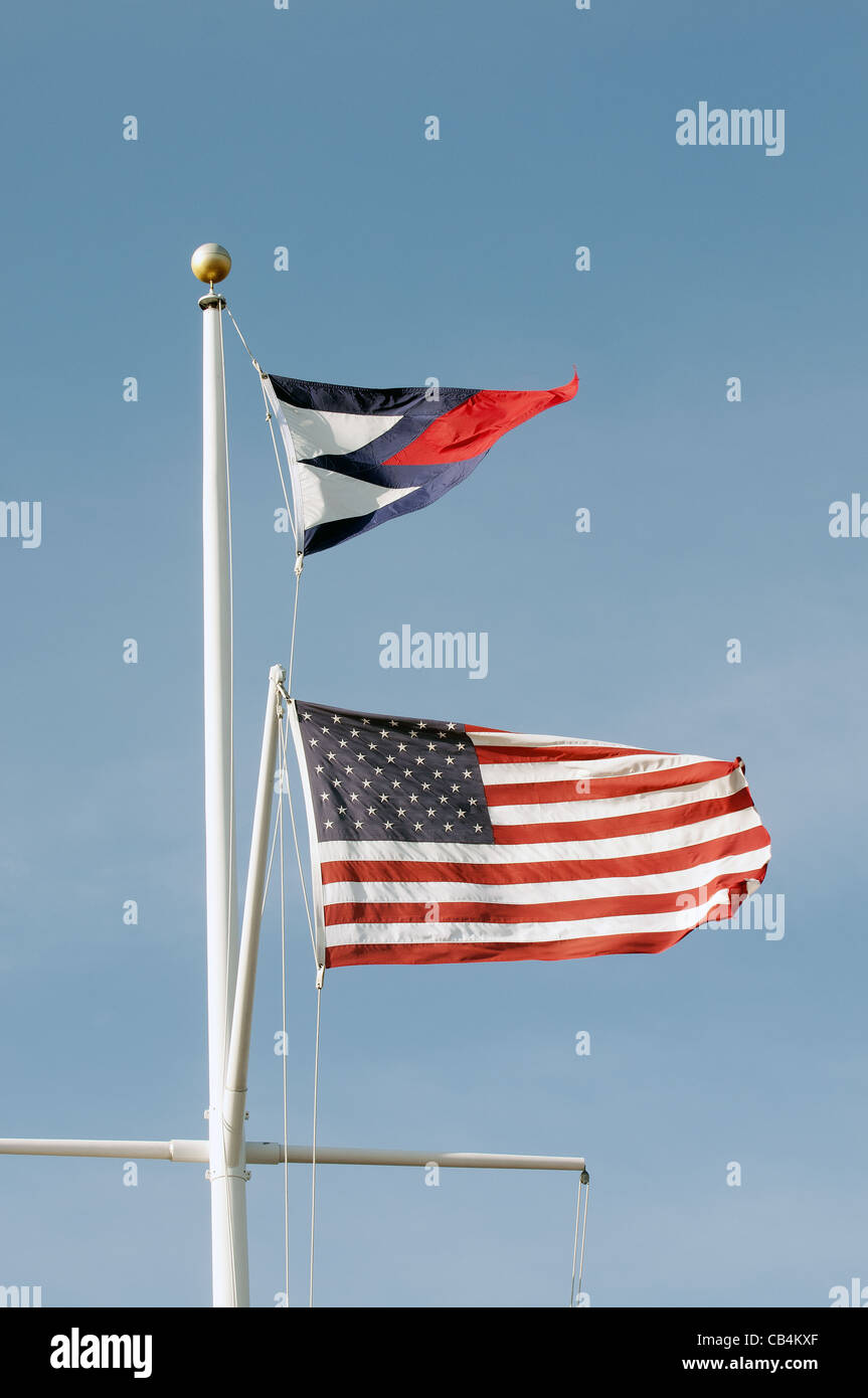 American flag and pennant flying over watch hill yacht club in Westerly Rhode island Stock Photo