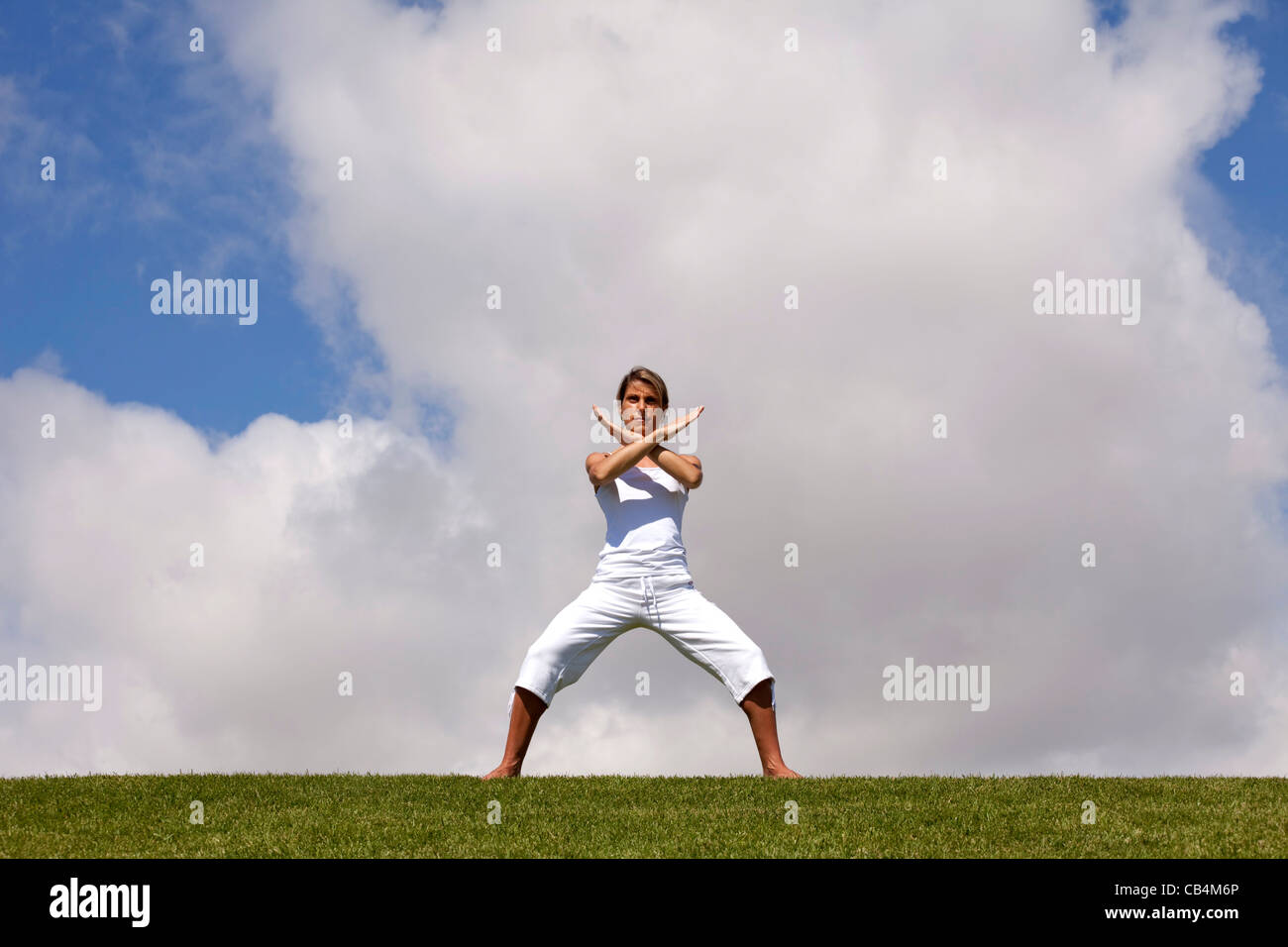 young woman doing some exercise at the park Stock Photo
