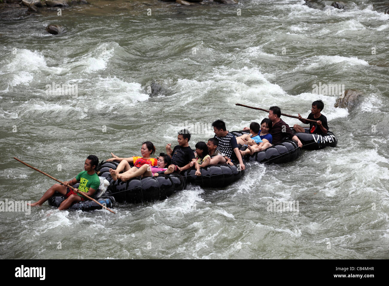Rafting on connected inner tubes. Bohorok River, Gunung Leuser National