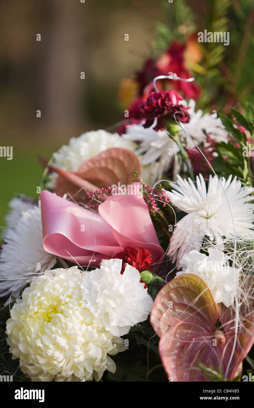Flower arrangement on grave, closeup Stock Photo Alamy