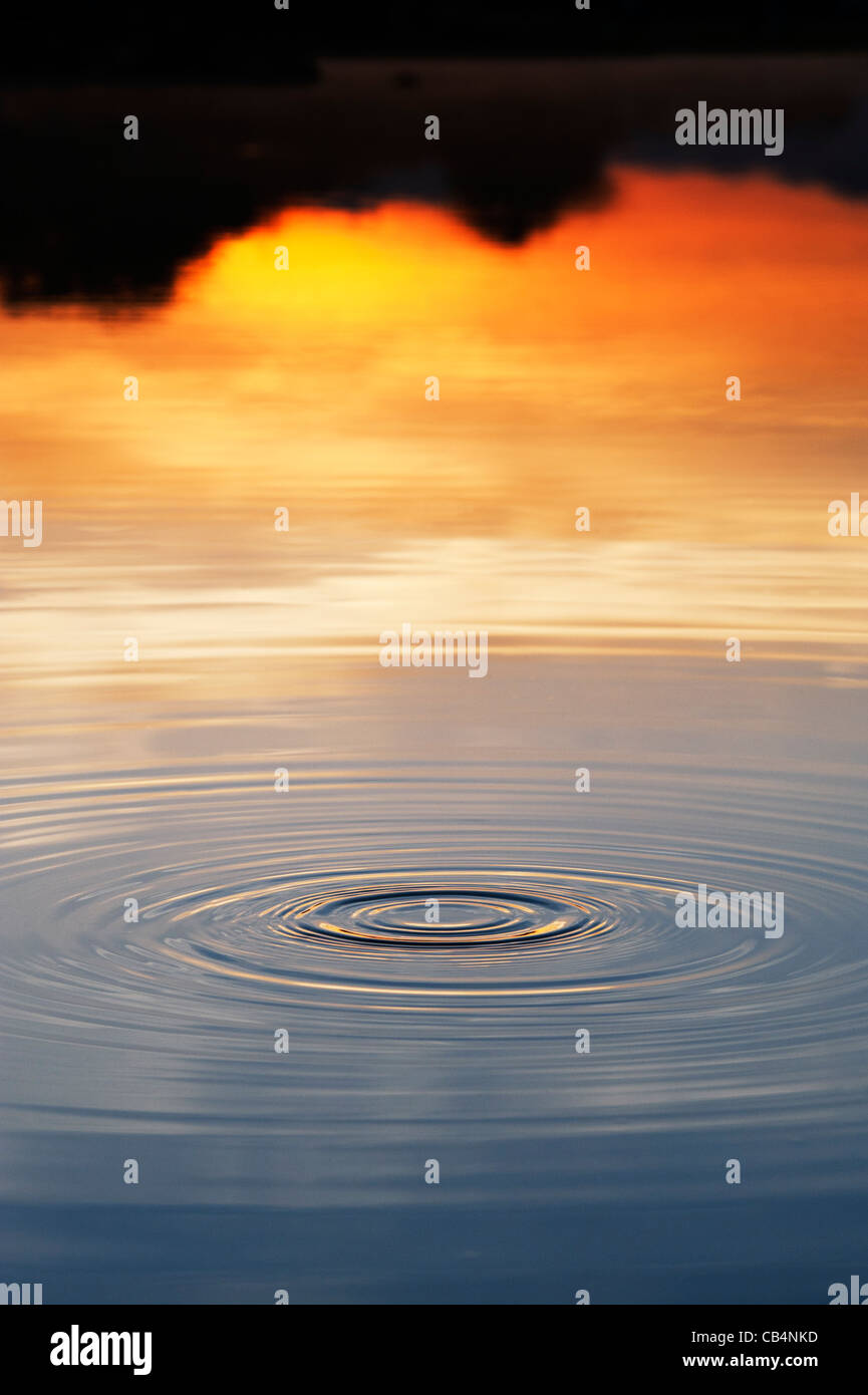 Golden water ripple at sunrise in India Stock Photo