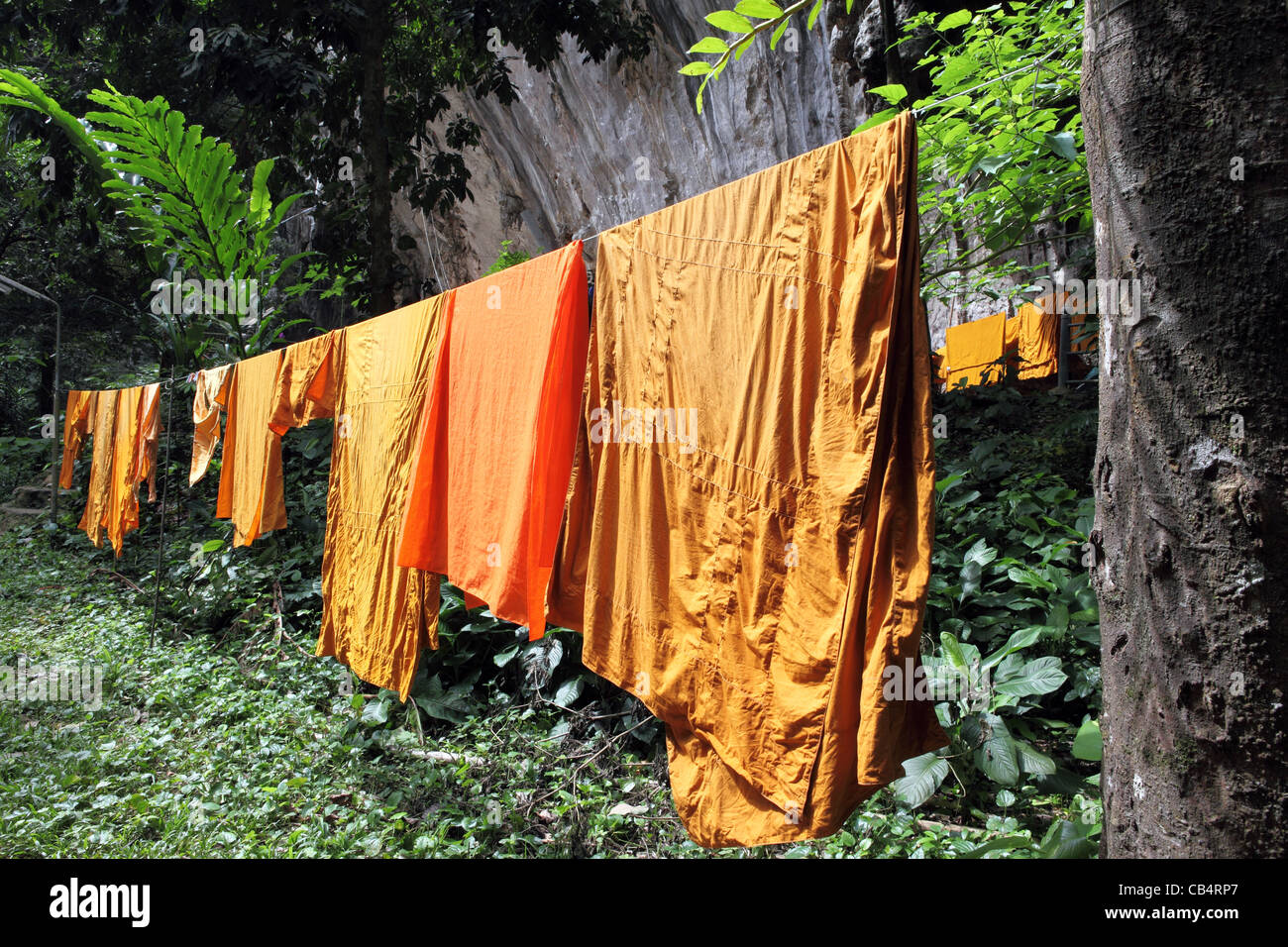 Monks robes drying on washing line at Wat Tham Seua (Tiger Cave) temple. Krabi, Thailand, South-East Asia, Asia Stock Photo