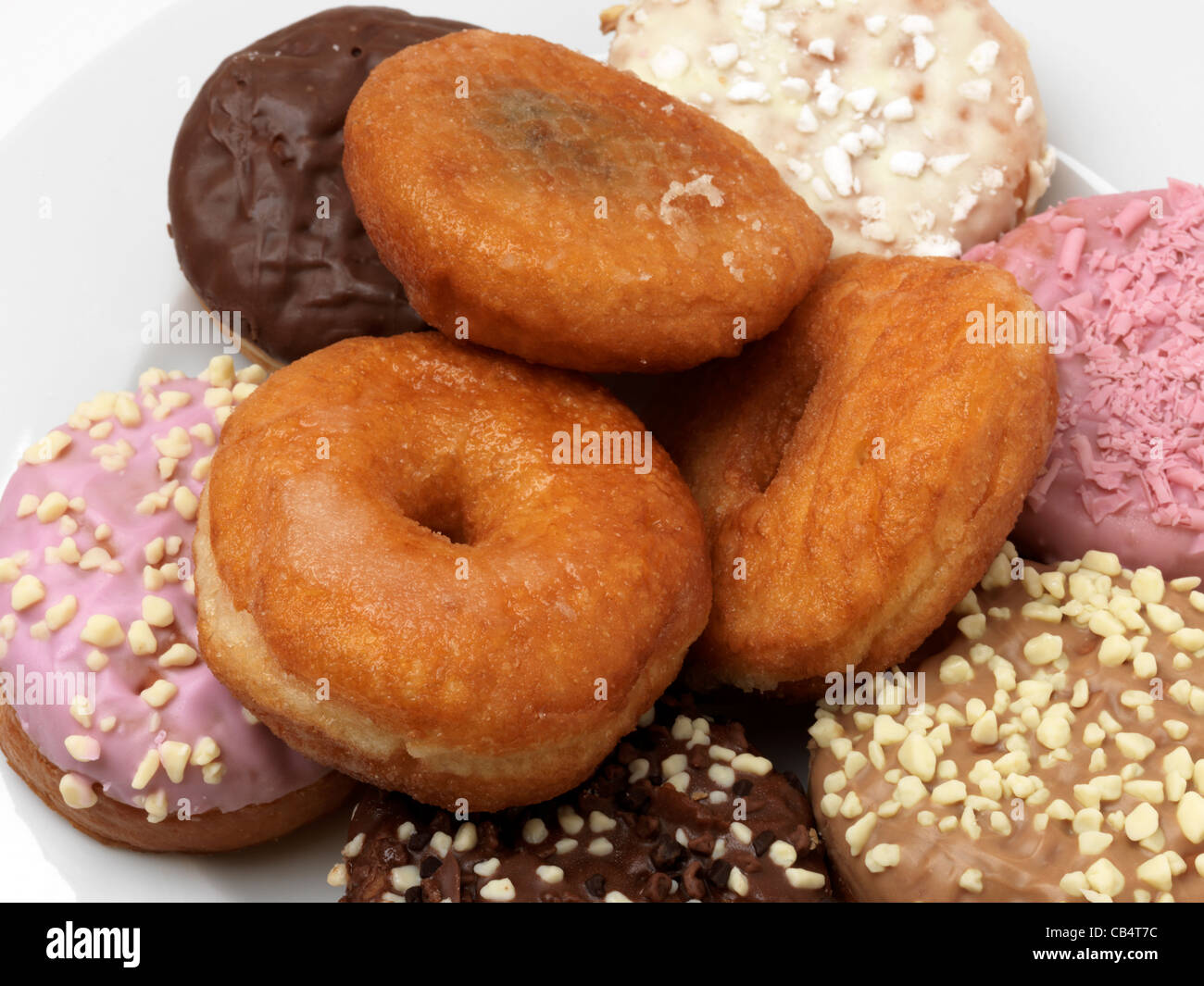 A Selection Of Doughnuts Some With Holes In Others With Jam And Icing Stock Photo