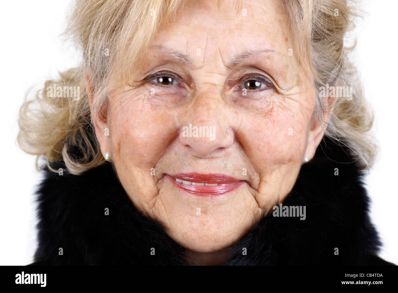 Happy senior woman portrait wearing fur collar, great details Stock Photo