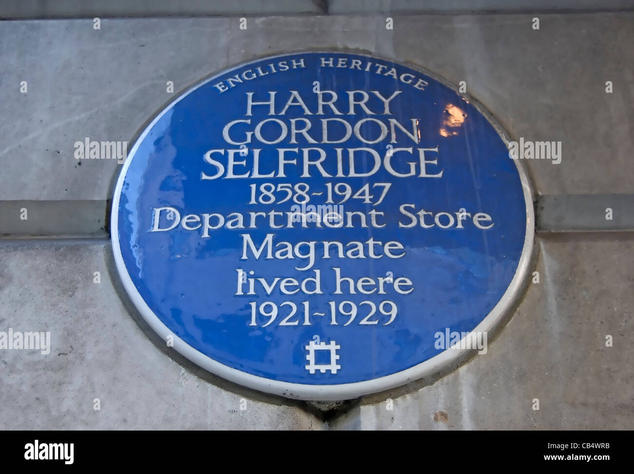 english heritage blue plaque marking a home of department store magnate