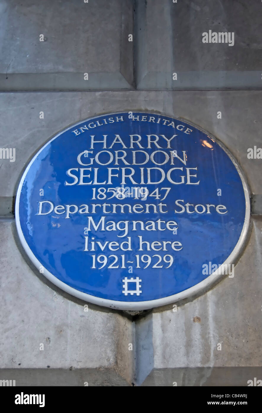 english heritage blue plaque marking a home of department store magnate