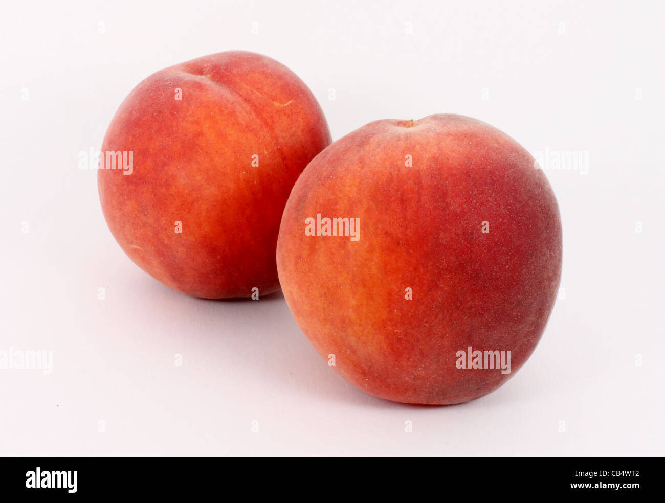 Two fresh ripe peaches, isolated Stock Photo - Alamy