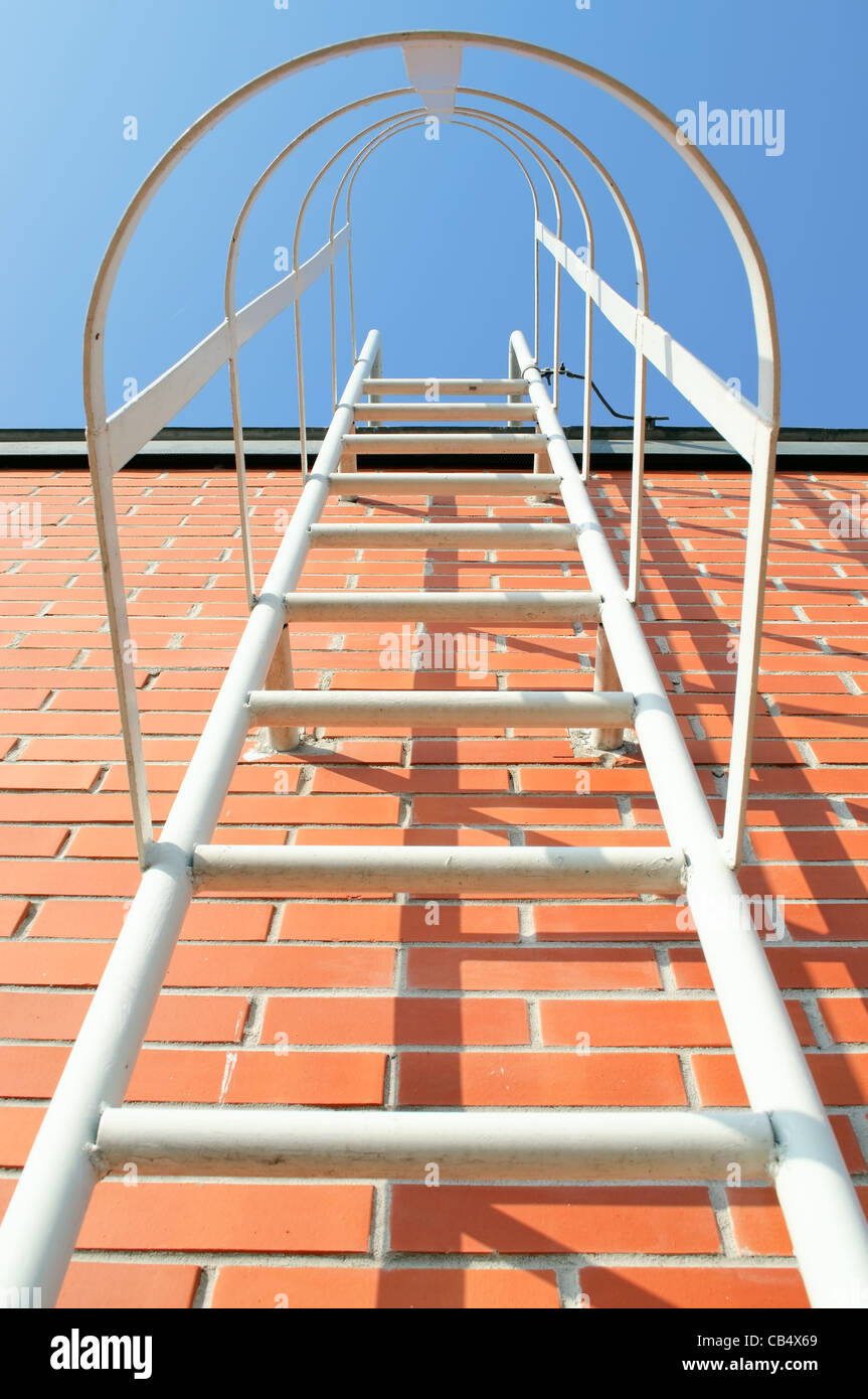Metal ladder on the roof of an industrial building Stock Photo Alamy
