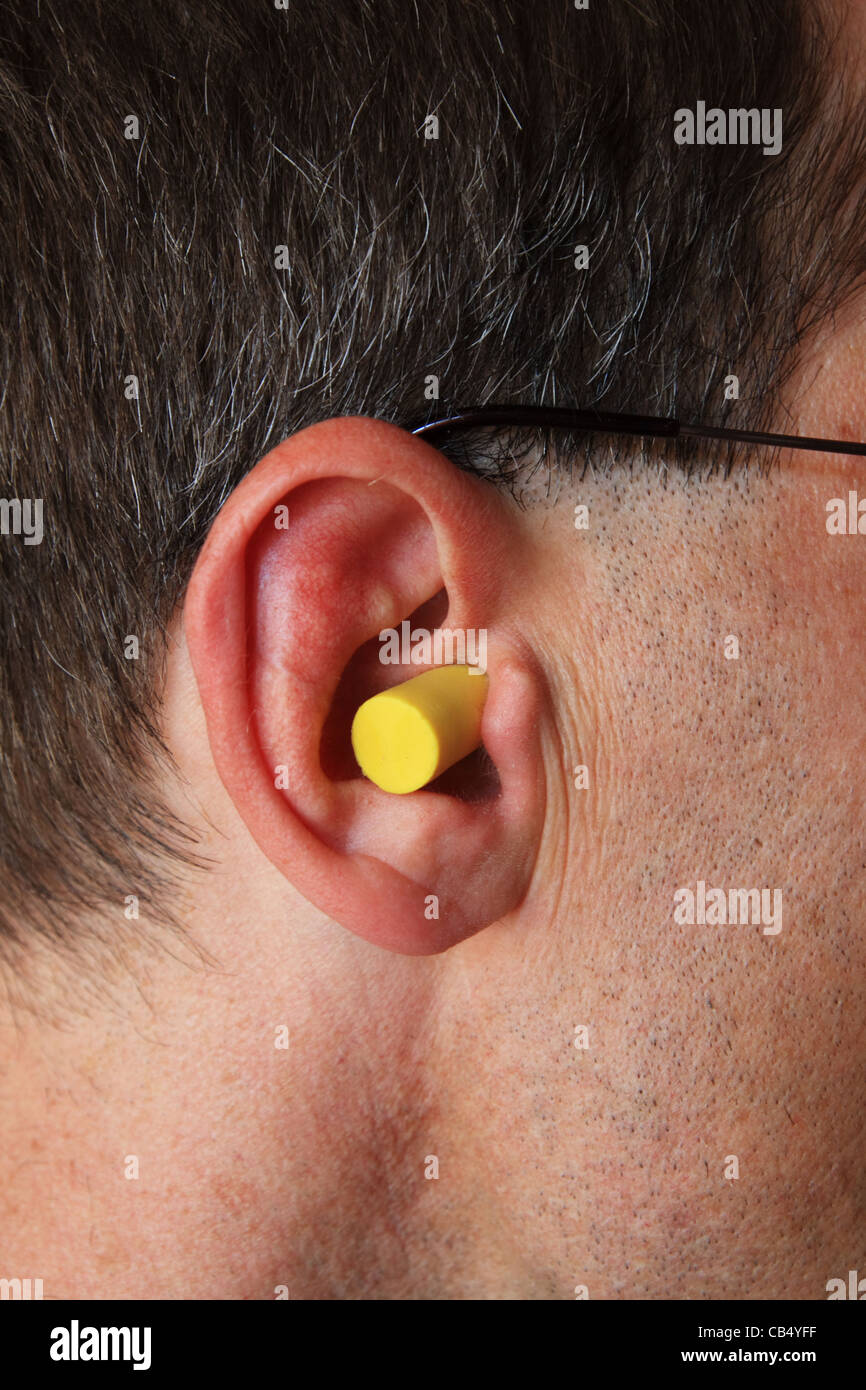 Download A Man S Ear With Yellow Foam Earplug Stock Photo Alamy PSD Mockup Templates