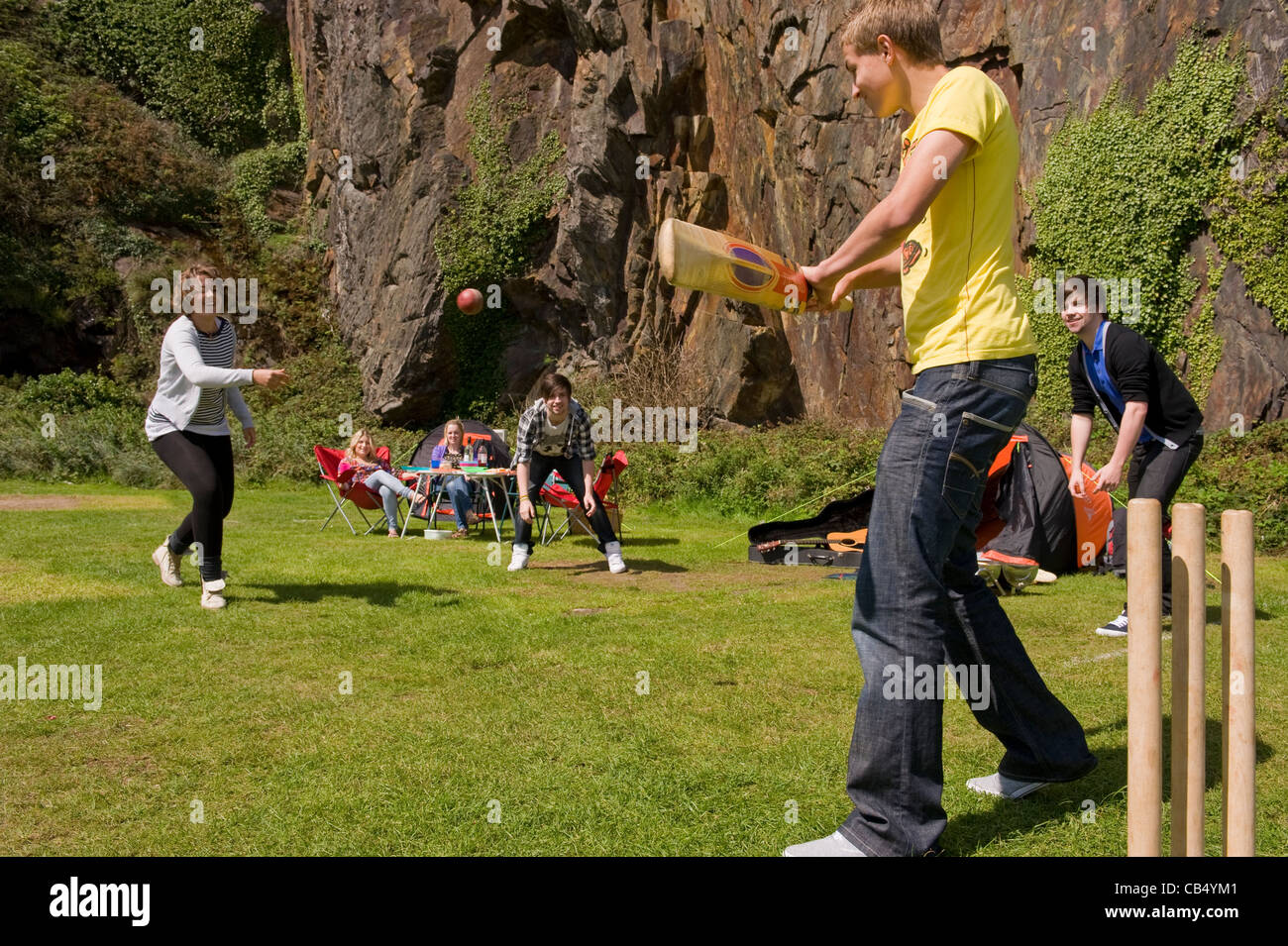 A group of young people camping and having fun at Black Rock Sands in ...