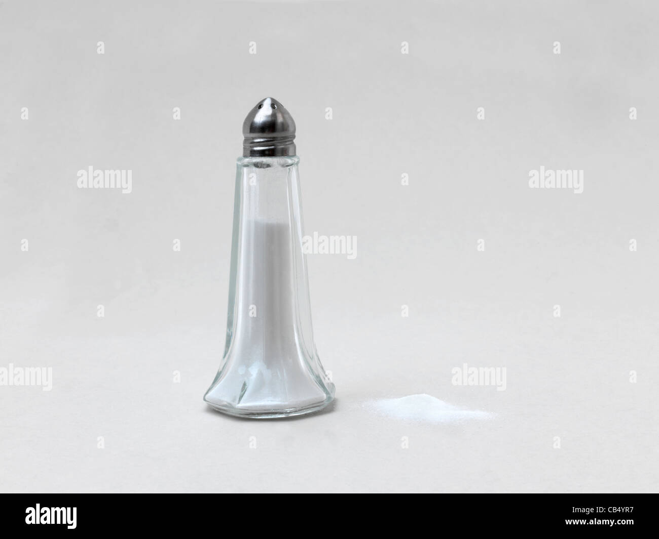 Salt Cellar With A Mound Of Salt Next To It Stock Photo Alamy