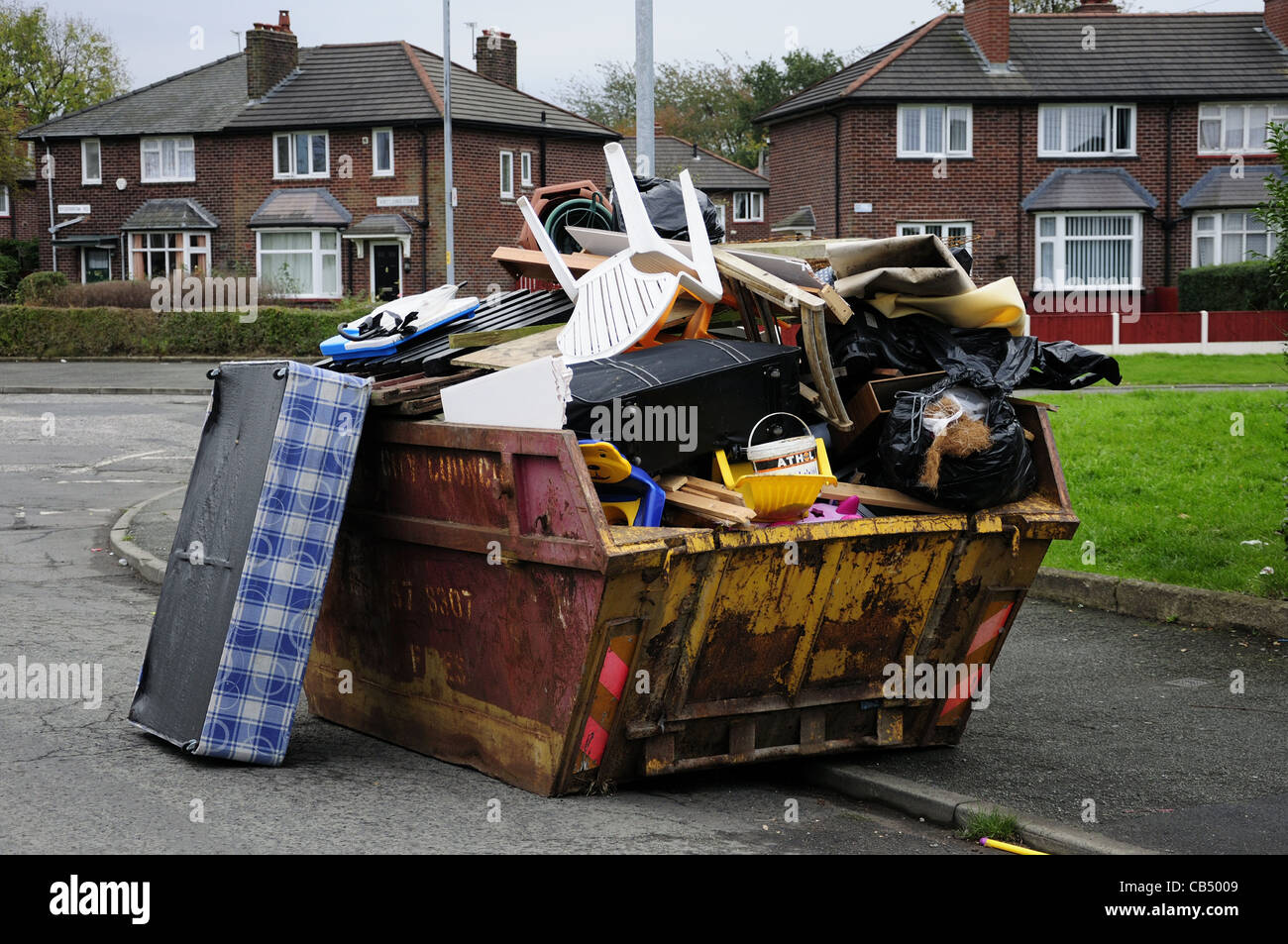 Skip full of domestic rubbish Stock Photo - Alamy