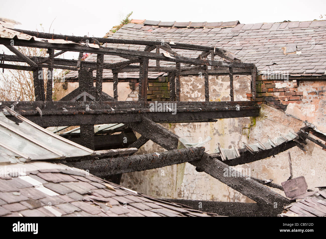 An old mill building destroyed by arsonists in Burnley, Lancashire, UK. Stock Photo