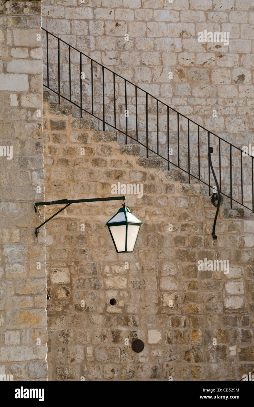 Lantern on wall bracket, Trg Sveti Stjepana or St Stephens Square in Hvar town, Croatia Stock Photo