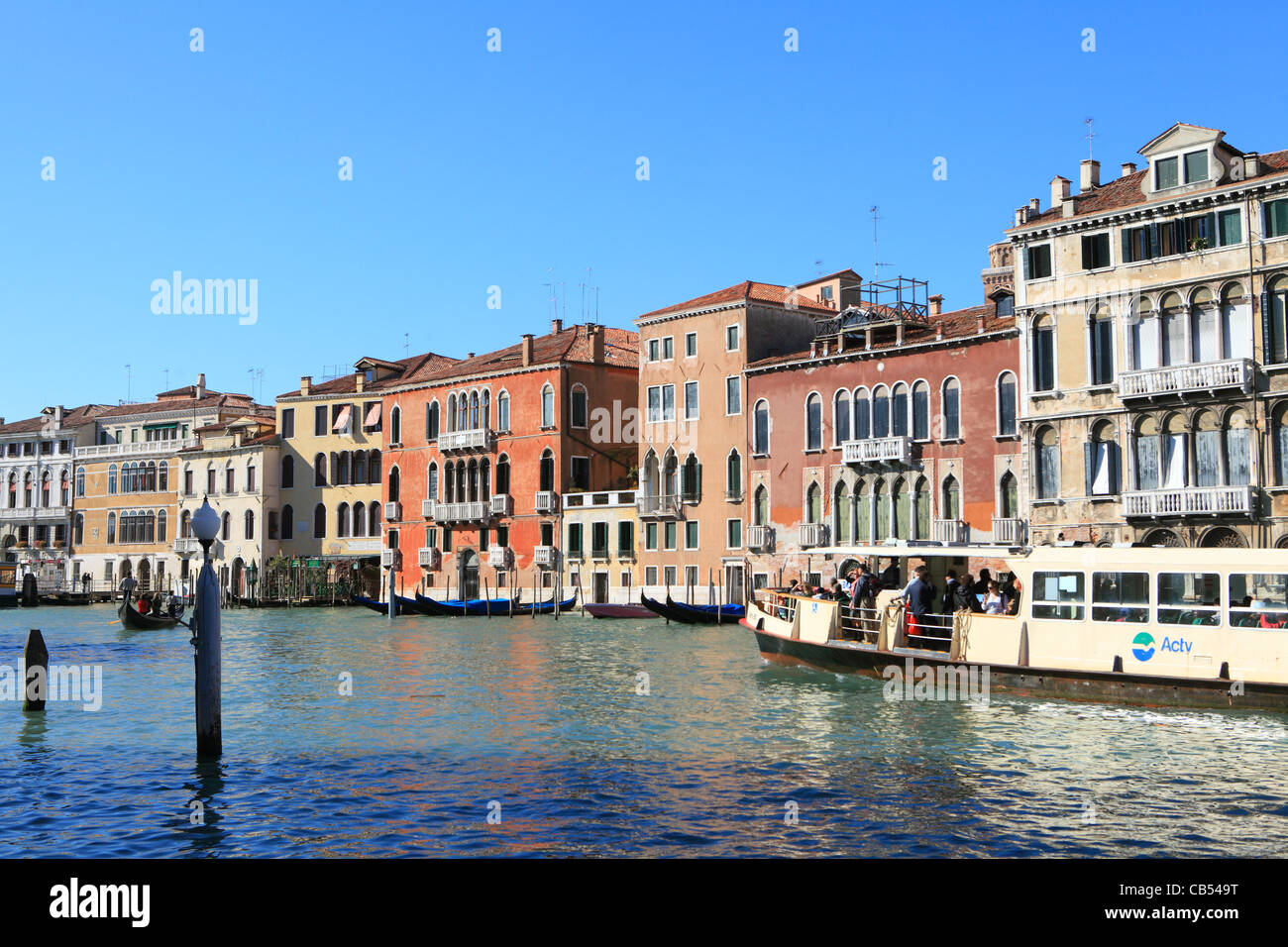 A vaporetto water ferry in the Grand Canal of Venice. These boats are the main transport system in the archipelago. Stock Photo