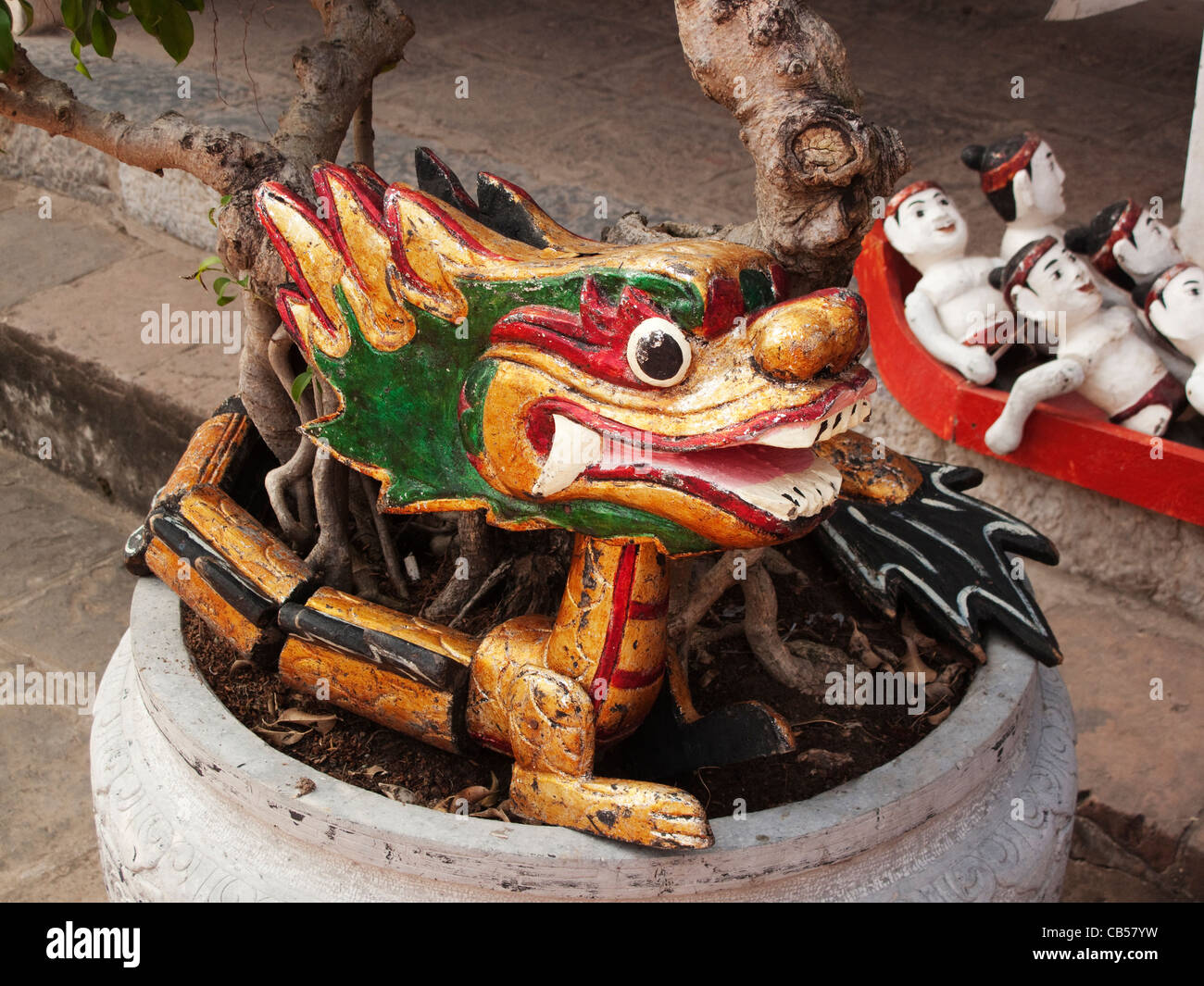 Dragon water puppet on a plant pot at the Temple of Literature in Hanoi, Vietnam Stock Photo