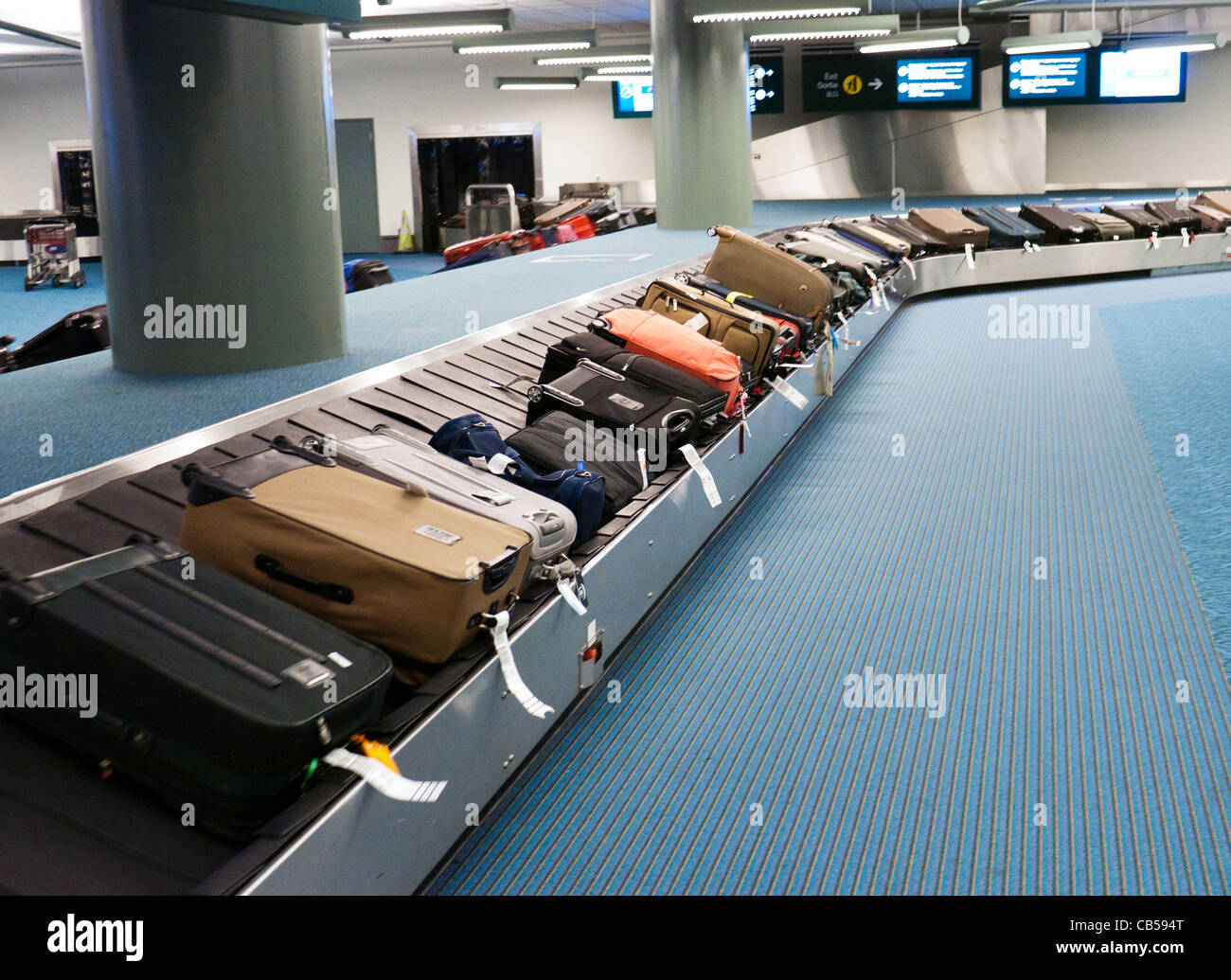 Suitcases on a luggage carousel at an airport Stock Photo Alamy